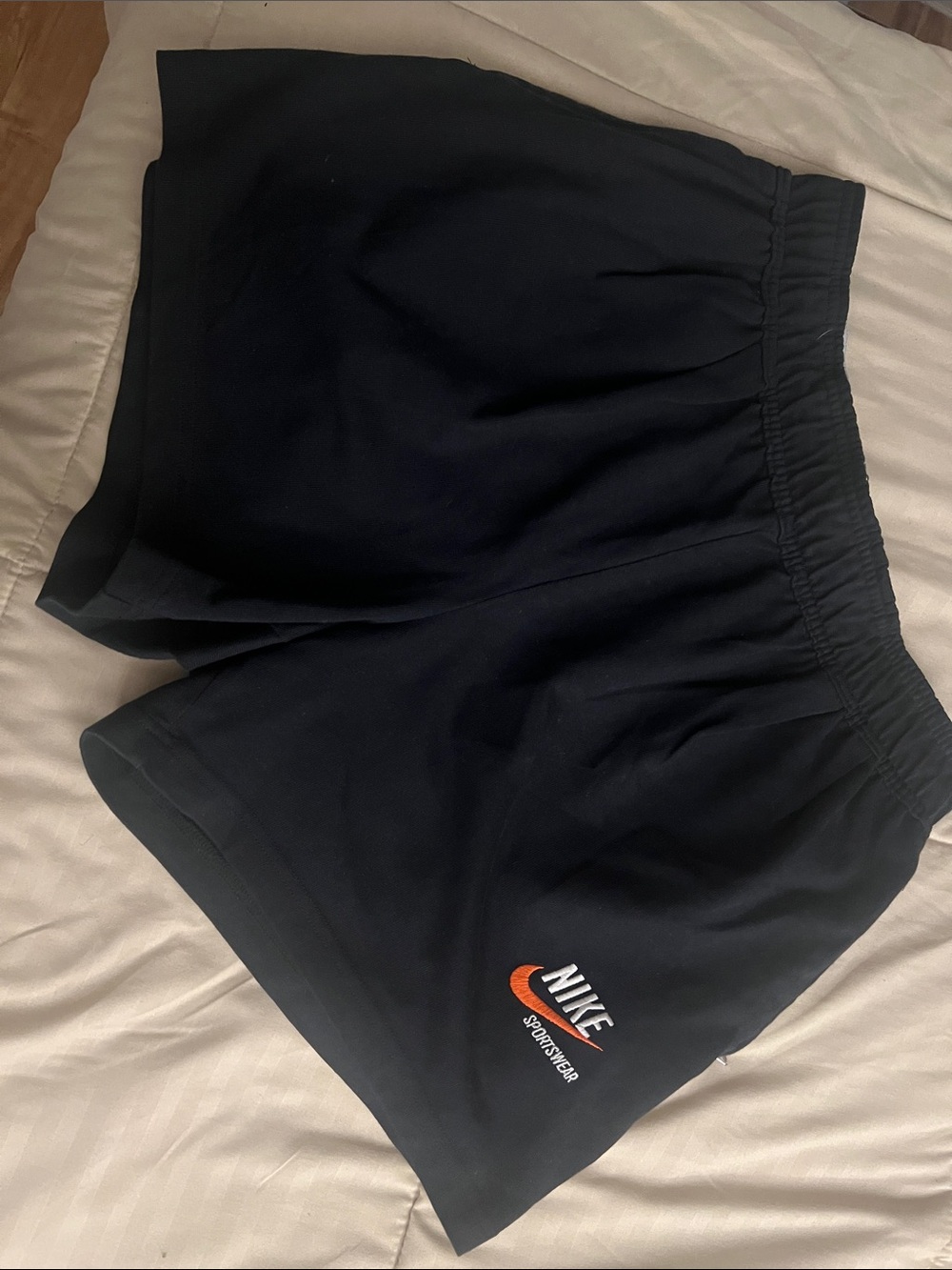 Nike Black Women's Athletic Shorts with Orange Logo
